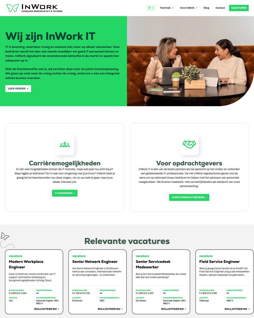 De IT-pagina van InWork met merkkleur en beeld van twee collega's.